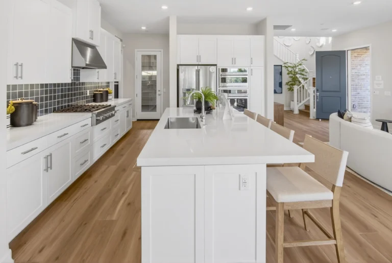 Kitchen with pantry door, ample storage and island