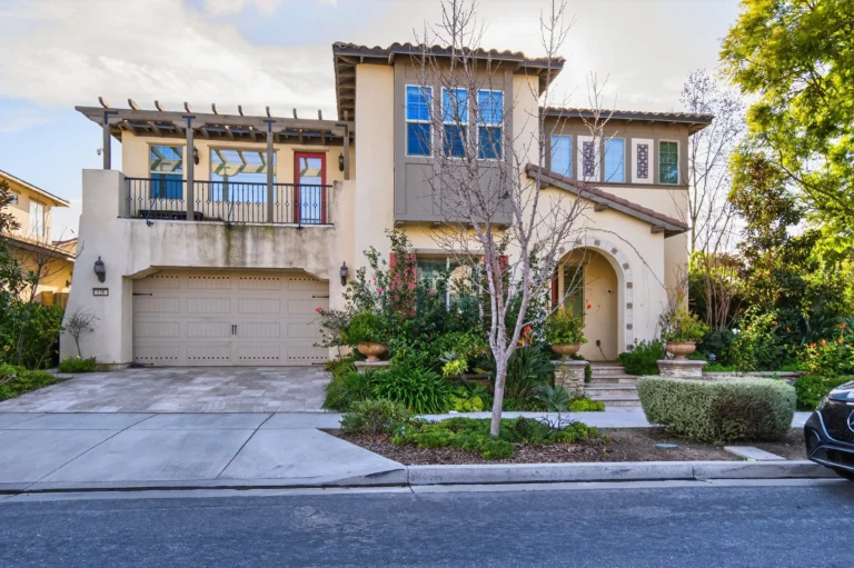 Home exterior with balcony and railing along front
