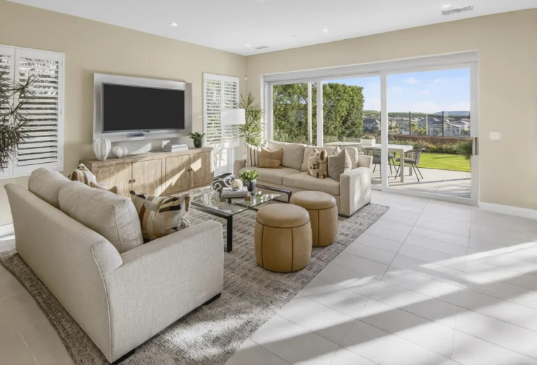 Living room showcasing indoor outdoor connection to rear yard