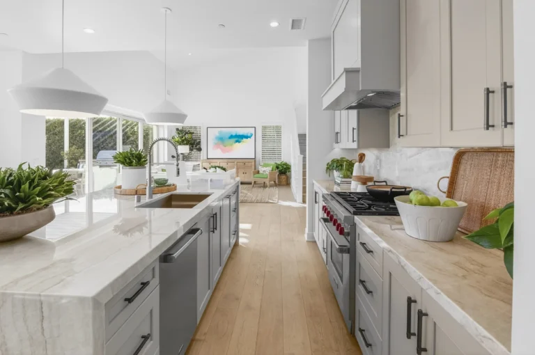 Kitchen styled with greenery and neutral accessories for listing photos