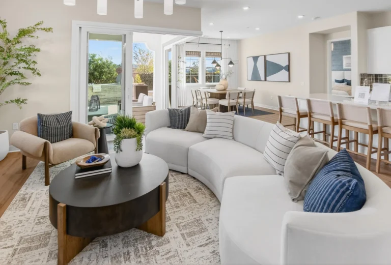 Living room showcasing indoor outdoor connection to rear yard