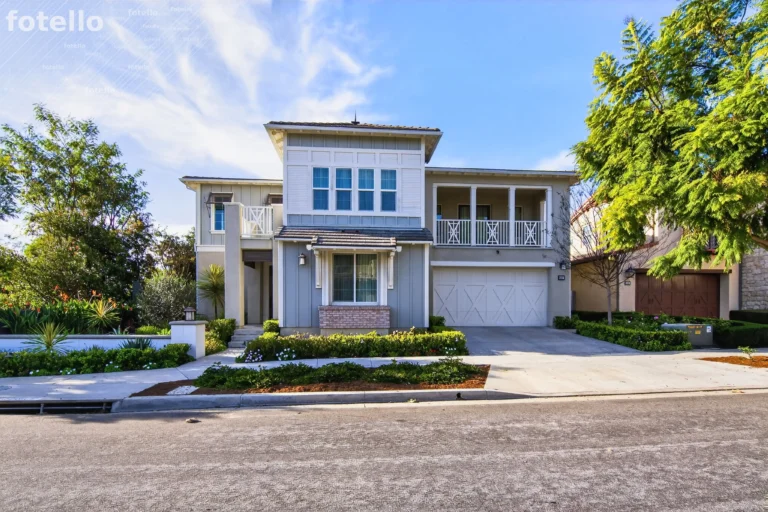 Front exterior framed by mature trees and lush planting
