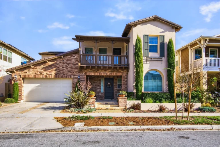 New construction exterior showcasing fresh paint, modern windows and garage