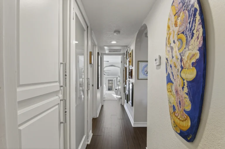 Hallway with eclectic art on the walls