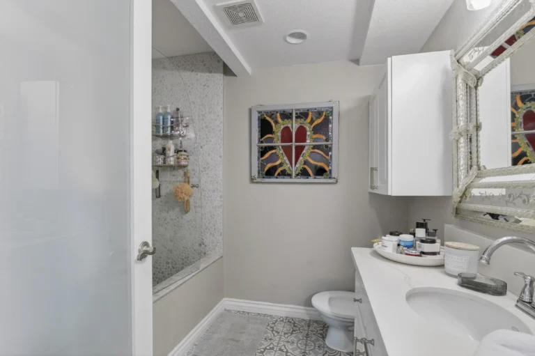 Bathroom styled with spa like decor and light color palette
