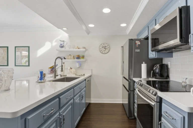Kitchen featuring farmhouse sink and classic style cabinetry