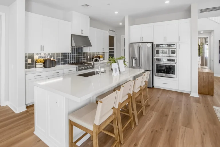 Kitchen showcased from corner angle to capture full layout and open concept
