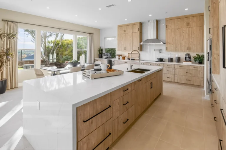 Kitchen with contrasting countertops and coordinating metal fixtures