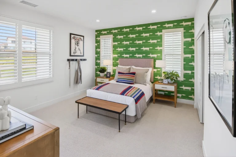 Guest bedroom with simple decor and clean, inviting layout