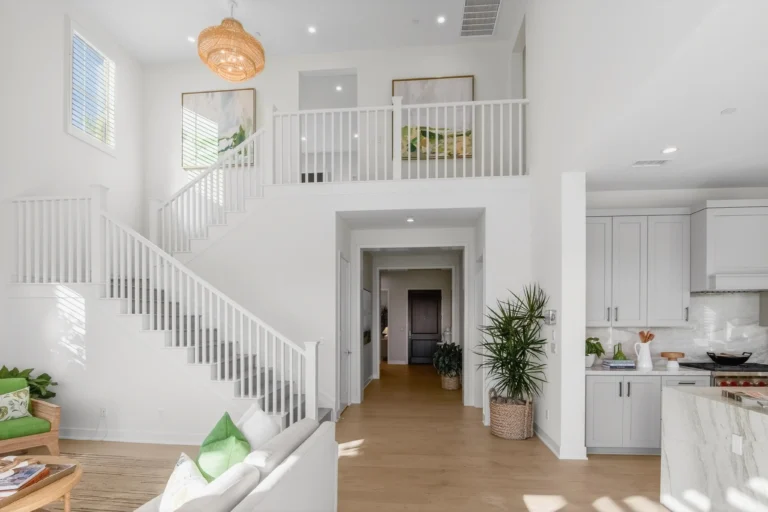 Upstairs landing with railing overlooking two story living room