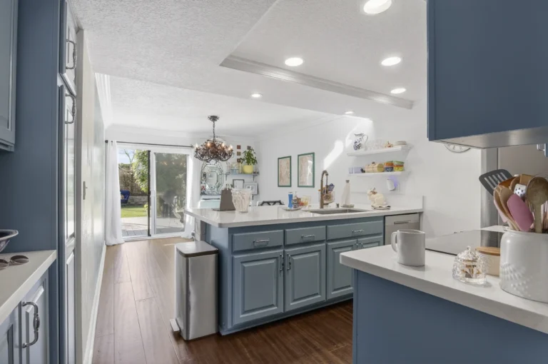 Kitchen with contrasting countertops and coordinating metal fixtures