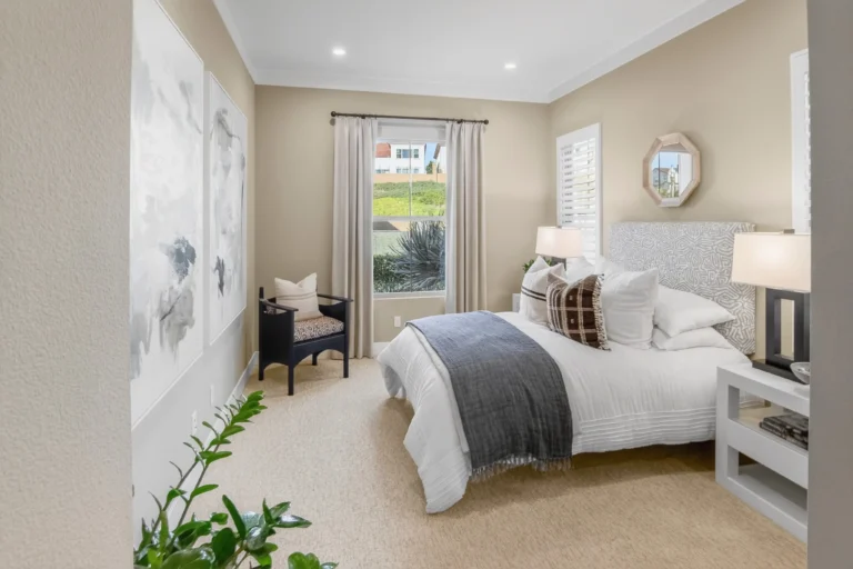 Bedroom staged with artwork and coordinated accent pillows