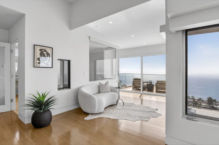 master bedroom sitting area with ocean view